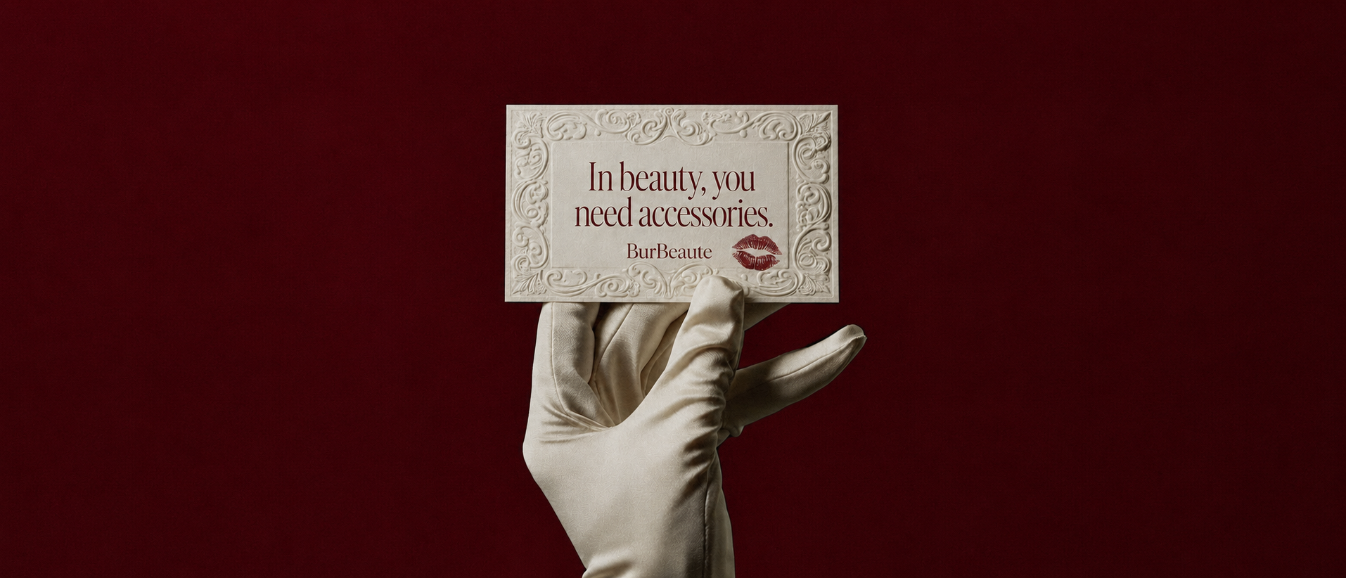 BurBeaute cream message card held by a satin-gloved hand on burgundy background